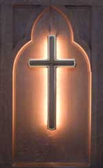 Image of a one foot high gold cross with back light.