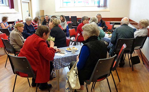 Image of people having refreshments at the Christian aid coffee morning.